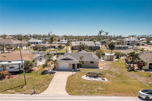 birds eye view of property with a residential view