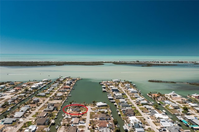 birds eye view of property featuring a residential view and a water view