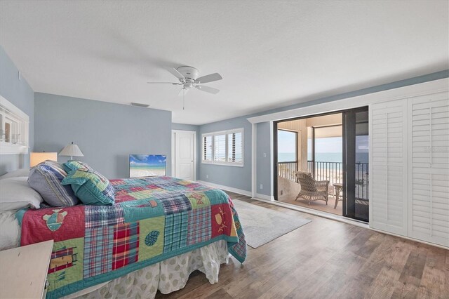 5000 Gasparilla Rd Unit 41B, Boca Grande, FL 33921 - bedroom with access to outside, wood finished floors, baseboards, and ceiling fan