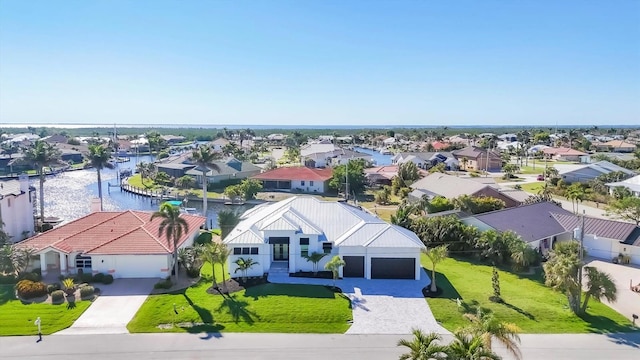bird's eye view with a residential view and a water view