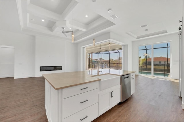 kitchen featuring dark wood finished floors, a sink, visible vents, and stainless steel dishwasher