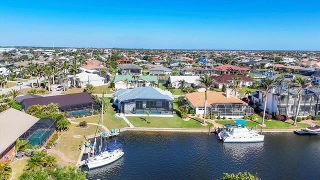 aerial view with a residential view and a water view
