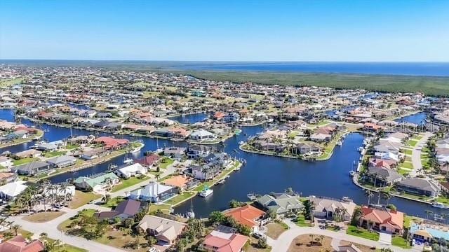 bird's eye view with a water view and a residential view