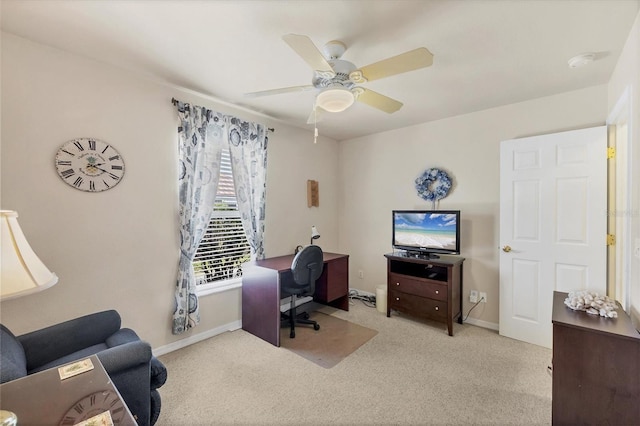 office featuring baseboards, ceiling fan, and carpet floors