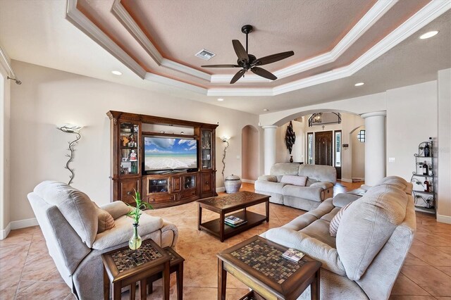 14810 Ingraham Blvd, Port Charlotte, FL 33981 - living area featuring arched walkways, ornate columns, a tray ceiling, ceiling fan, and recessed lighting
