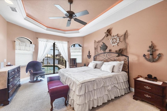14810 Ingraham Blvd, Port Charlotte, FL 33981 - bedroom with light colored carpet, a tray ceiling, ornamental molding, baseboards, and ceiling fan