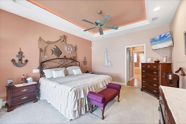 14810 Ingraham Blvd, Port Charlotte, FL 33981 - bedroom featuring light colored carpet, a raised ceiling, baseboards, a ceiling fan, and ensuite bathroom