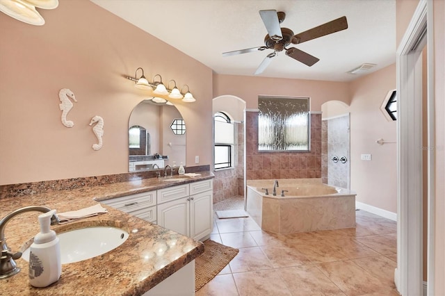 14810 Ingraham Blvd, Port Charlotte, FL 33981 - full bathroom featuring a bath, ceiling fan, a walk in shower, vanity, and tile patterned floors