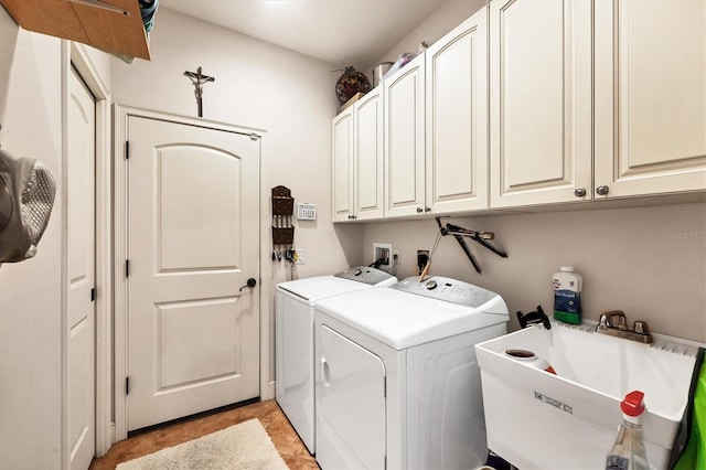 14810 Ingraham Blvd, Port Charlotte, FL 33981 - laundry room with separate washer and dryer, cabinet space, and light tile patterned flooring