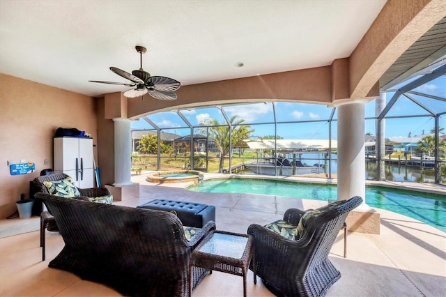 14810 Ingraham Blvd, Port Charlotte, FL 33981 - view of swimming pool with a lanai, a patio area, a pool with connected hot tub, a water view, and ceiling fan