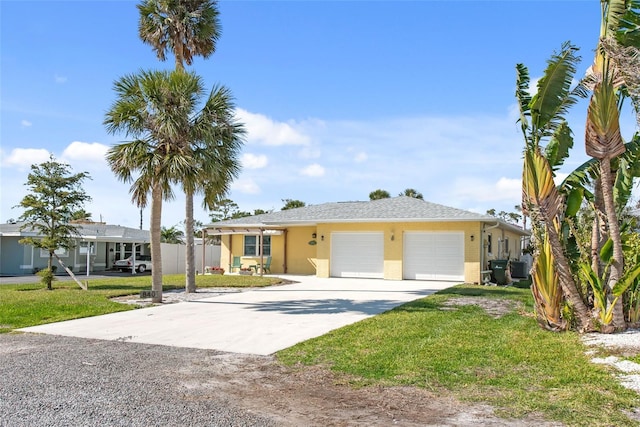 840 Park Rd, Englewood, FL 34223 - ranch-style house featuring a garage, concrete driveway, a front lawn, and stucco siding