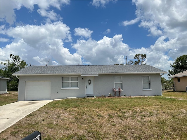 ranch-style home featuring a garage, driveway, a front lawn, and stucco siding