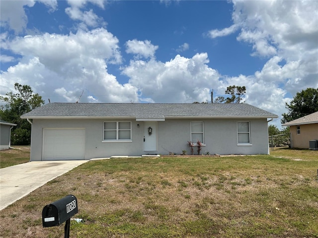 single story home with an attached garage, stucco siding, a front yard, and concrete driveway