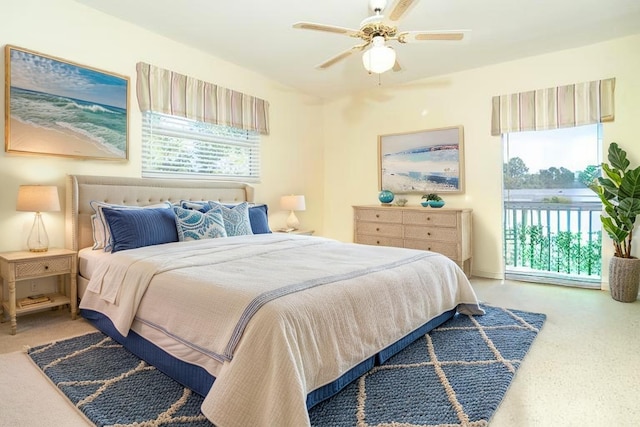 carpeted bedroom featuring a ceiling fan and multiple windows