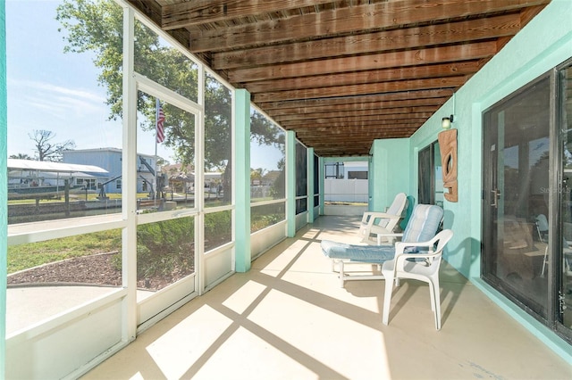 sunroom / solarium featuring a healthy amount of sunlight