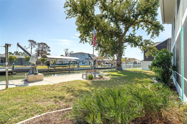 view of yard featuring fence and a water view