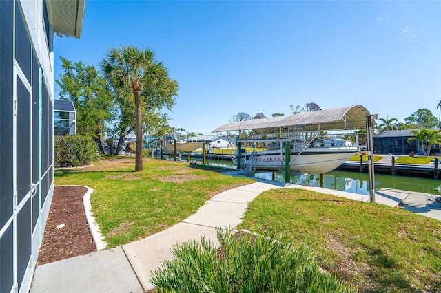 surrounding community featuring a yard, a water view, a dock, and boat lift