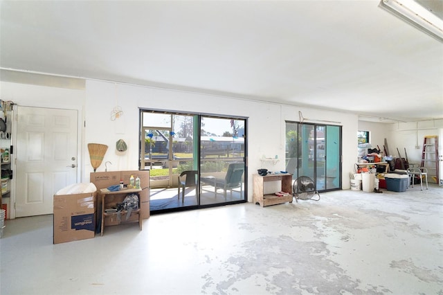 living room featuring unfinished concrete floors
