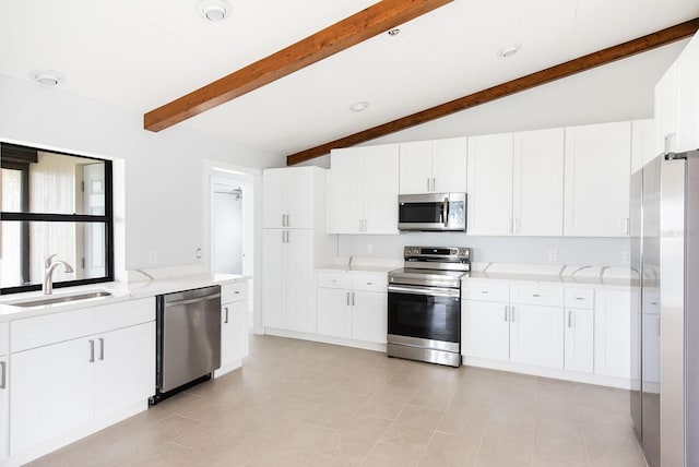 5266 Cooper Ter, Port Charlotte, FL 33981 - kitchen with stainless steel appliances, light stone countertops, and white cabinetry