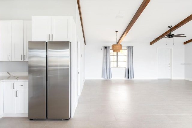 5266 Cooper Ter, Port Charlotte, FL 33981 - kitchen featuring freestanding refrigerator, beam ceiling, a ceiling fan, open floor plan, and white cabinets