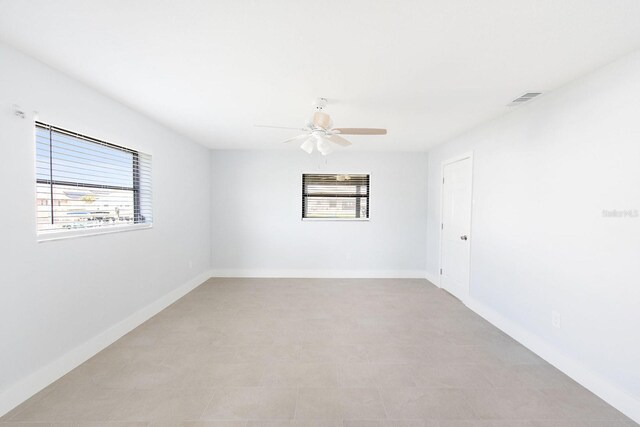 5266 Cooper Ter, Port Charlotte, FL 33981 - spare room featuring healthy amount of natural light and ceiling fan