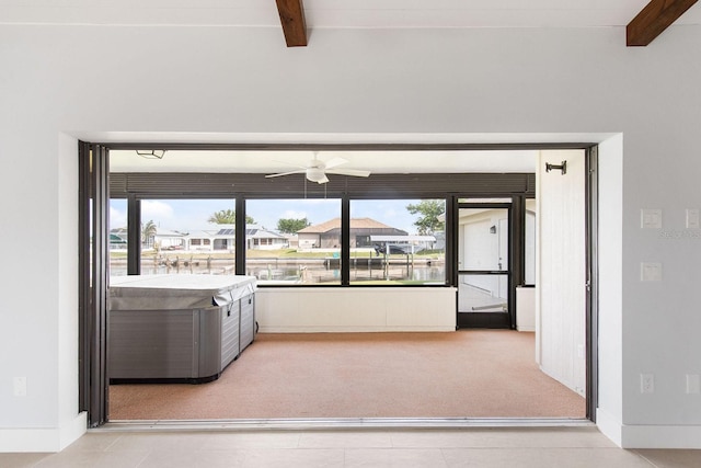 5266 Cooper Ter, Port Charlotte, FL 33981 - living room with beamed ceiling, a ceiling fan, carpet flooring, and healthy amount of natural light