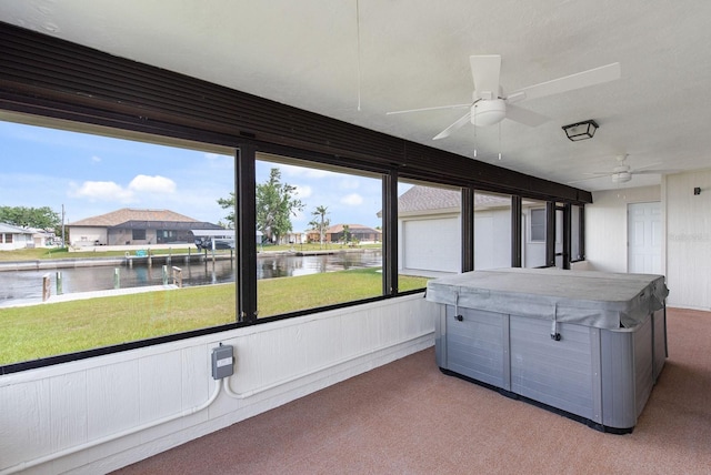 5266 Cooper Ter, Port Charlotte, FL 33981 - sunroom / solarium with a hot tub, a water view, and ceiling fan