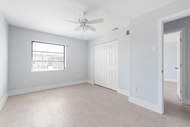 5266 Cooper Ter, Port Charlotte, FL 33981 - unfurnished bedroom featuring a closet, light tile patterned flooring, and ceiling fan