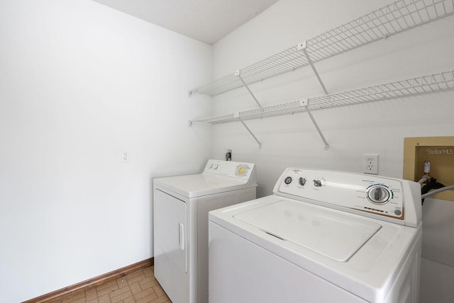 5266 Cooper Ter, Port Charlotte, FL 33981 - laundry room with independent washer and dryer and brick patterned floors