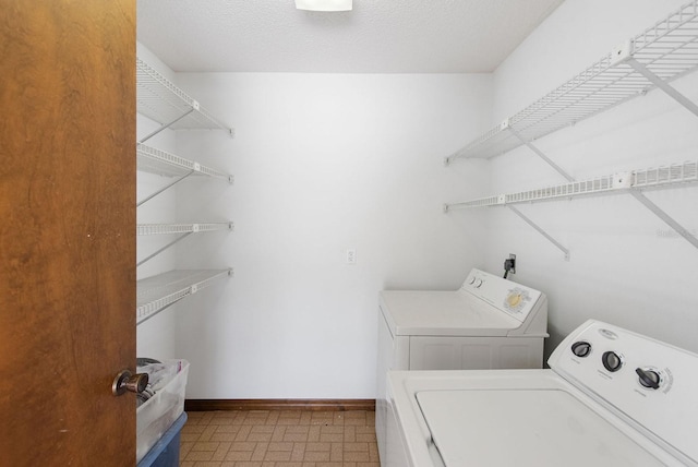 5266 Cooper Ter, Port Charlotte, FL 33981 - washroom with washing machine and dryer and baseboards