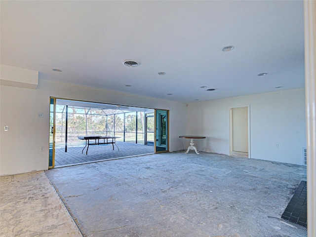 spare room featuring visible vents and a sunroom