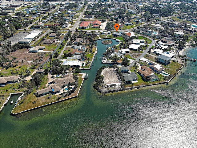 drone / aerial view featuring a residential view and a water view