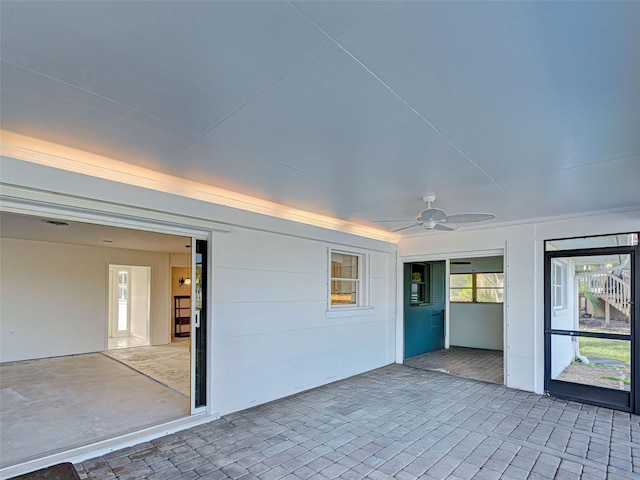 unfurnished sunroom featuring a wealth of natural light