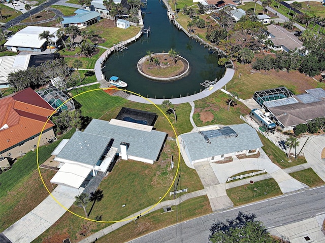 birds eye view of property featuring a water view and a residential view