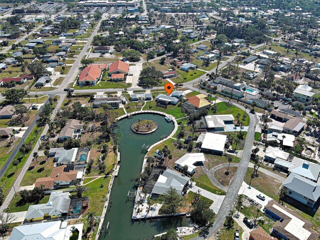drone / aerial view featuring a residential view and a water view