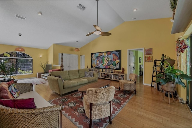 850 Van Gogh Rd, Englewood, FL 34223 - living area with wood finished floors, ceiling fan, and high vaulted ceiling