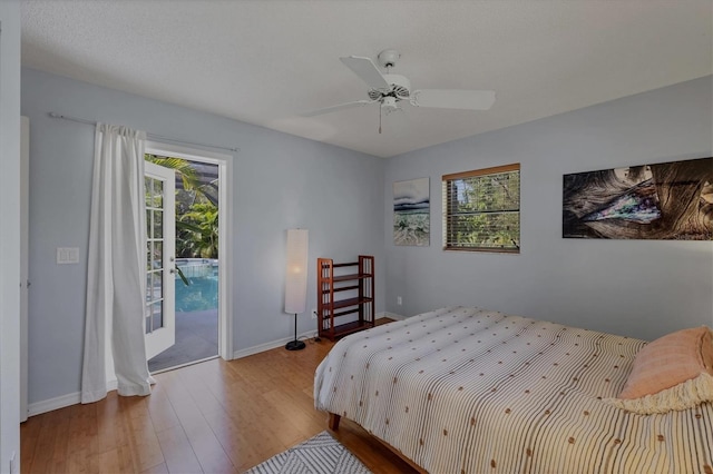 850 Van Gogh Rd, Englewood, FL 34223 - bedroom with access to exterior, wood finished floors, and a ceiling fan