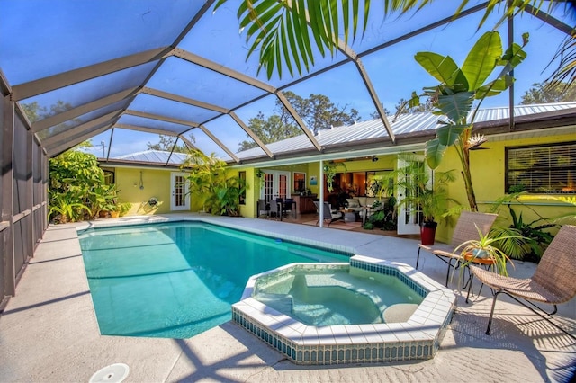 850 Van Gogh Rd, Englewood, FL 34223 - view of pool featuring french doors, a patio, a pool with connected hot tub, a lanai, and a ceiling fan