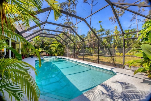 850 Van Gogh Rd, Englewood, FL 34223 - view of pool featuring a pool with connected hot tub, a patio, and glass enclosure