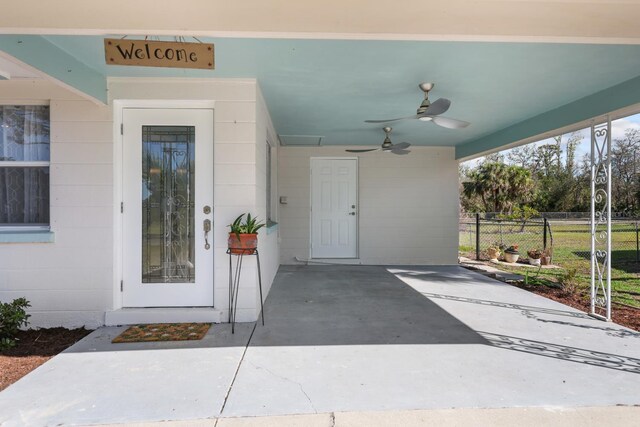 1493 Kathleen Pl, Englewood, FL 34223 - property entrance with concrete block siding and ceiling fan
