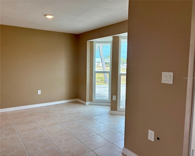 3415 Gulf Ln, Rotonda West, FL 33947 - empty room featuring light tile patterned floors and baseboards