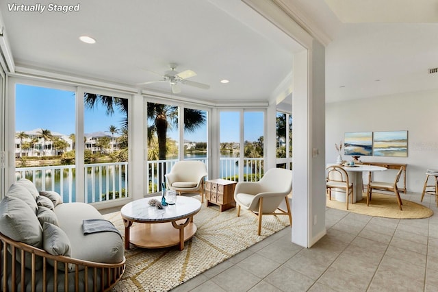 768 Seaboard Line Ln, Boca Grande, FL 33921 - sunroom / solarium with a water view, tile patterned flooring, and recessed lighting