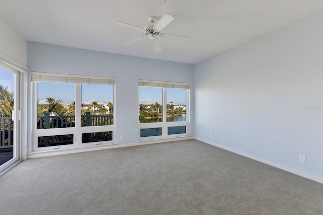 768 Seaboard Line Ln, Boca Grande, FL 33921 - spare room with carpet floors, baseboards, and ceiling fan