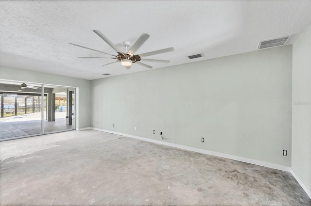 unfurnished room featuring unfinished concrete flooring, ceiling fan, a textured ceiling, and visible vents