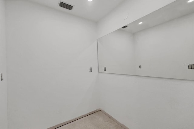 empty room with light carpet, baseboards, visible vents, and recessed lighting