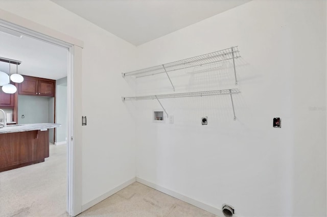 laundry area featuring laundry area, hookup for a washing machine, baseboards, and hookup for an electric dryer