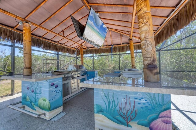 view of patio / terrace featuring a gazebo, grilling area, area for grilling, and glass enclosure