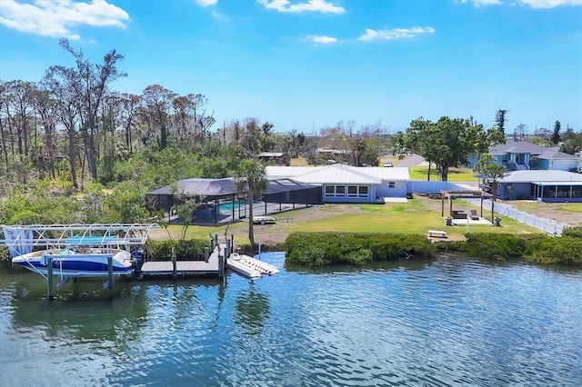 view of dock featuring boat lift, a water view, and a yard