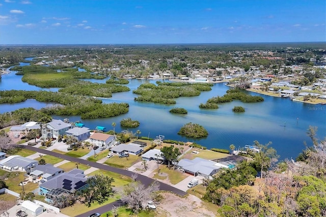 birds eye view of property with a residential view and a water view
