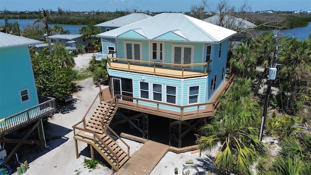 8152 Little Gasparilla Is, Placida, FL 33946 - rear view of property with metal roof, a water view, french doors, a balcony, and stairs